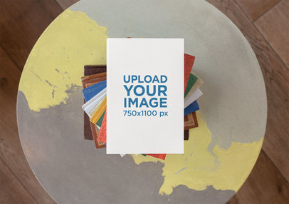 Mockup of a Book on a Pile of Colorful Books 30915
