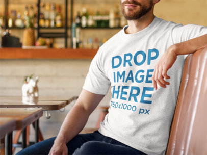 Tshirt Mockup Featuring a Young Man at a Diner