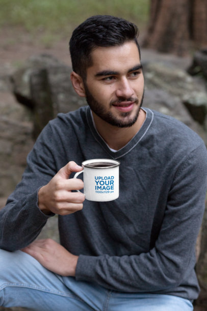 Mockup of a Man Drinking Coffee from a Silver Rim Enamel Mug in the Woods