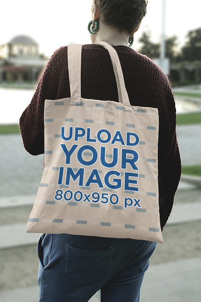 Tote Bag Mockup Featuring a Woman with Earrings