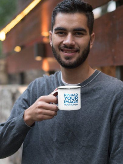 Mockup of a Smiling Man Holding His 12 oz Silver Rim Enamel Mug