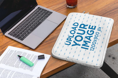 Mockup of a Laptop Sleeve Placed over a Working Desk