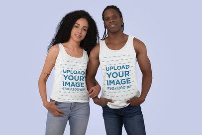 Mockup of a Smiling Couple Wearing Tank Tops in a Studio