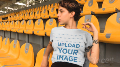 T-Shirt Video of a Woman Sitting in a Grandstand