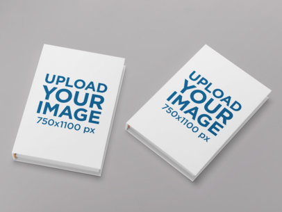 Hardcover Book Mockup Featuring Two Books on a Customizable Surface 30929