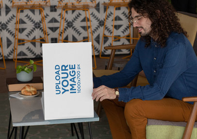 Hardcover Book Mockup Featuring a Man with Long Hair Reading