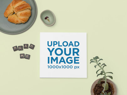 Mockup of a Squared Booklet on a Colored Breakfast Table 30937