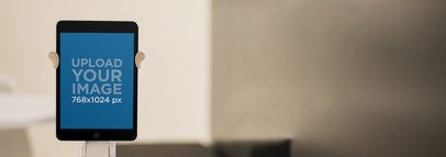 Tablet Mockup of a Black iPad Over a Blurry Background