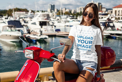 T-Shirt Mockup of a Cool Woman Sitting on a Motorcycle