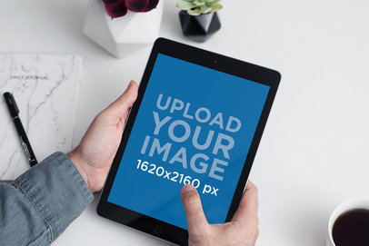Mockup of a Pair of Hands Holding an iPad in a Minimalistic Scenario 2167-el1