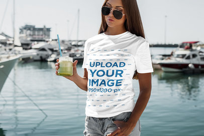 T-Shirt Mockup Featuring a Woman Drinking a Smoothie 