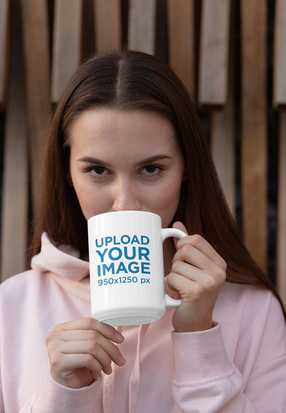 Mockup of a Woman Drinking Coffee from a 15 oz Mug 