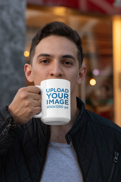 15 oz Mug Mockup Featuring a Young Man Drinking a Coffee 