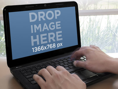 Mockup of a Man Using A Laptop