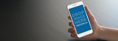 White iPhone 6s Mockup Over a Flat Backdrop