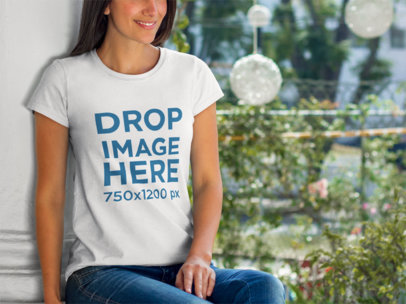 T-Shirt Mockup of a Smiling Young Woman at a Garden
