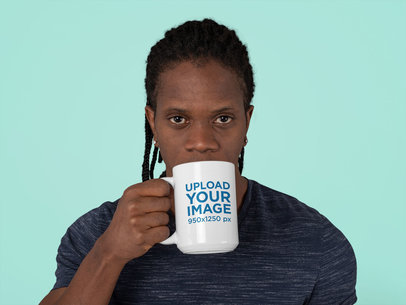 Mockup Featuring a Serious Man Drinking From a 15 oz Coffee Mug at a Studio