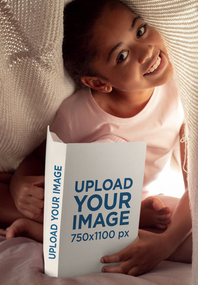 Book Mockup of a Smiling Girl Reading under a Blanket