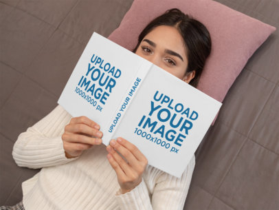 Mockup of a Woman Lying Down Holding a Book