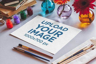 Mockup of a Sketch Paper Placed Among Watercolor Paints and Brushes 2282-el1