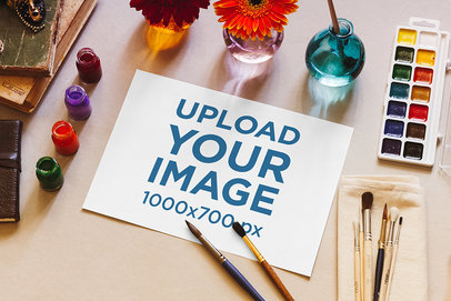 Mockup of a Watercolor Paper Surrounded by Art Supplies