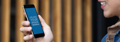 iPhone 6s Mockup of a Young Man Smiling at His Phone