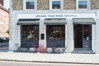 Storefront Mockup Placed on a Shop with Chairs Outside