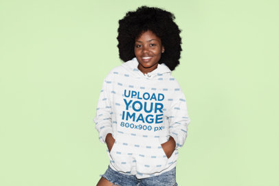 Mockup of a Young Woman Wearing a Pullover Hoodie in a Studio