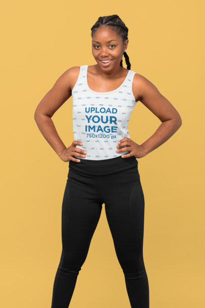 Mockup of a Confident Woman Wearing a Tank Top at a Studio