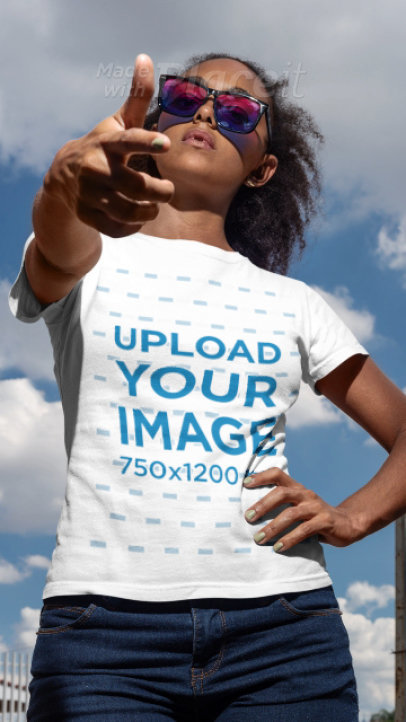 Video Featuring a Young Woman with Curly Hair Wearing a T-Shirt and Pointing at the Camera 22842