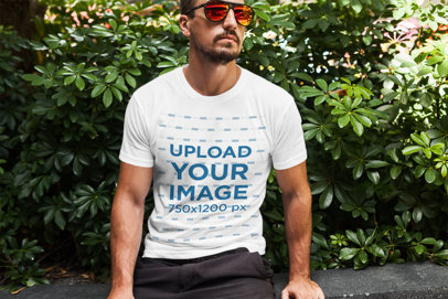 T-Shirt Mockup of a Cool Man Wearing Sunglasses 