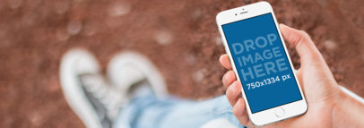 iPhone 6s Mockup Featuring a Teenager Outdoors a10095