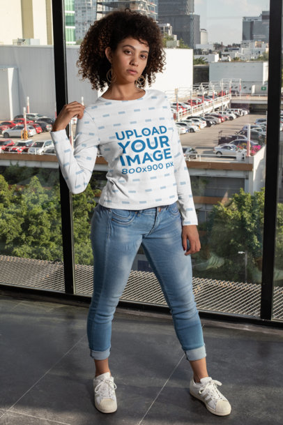 Mockup of a Woman with Curly Hair Wearing a Sublimated Long Sleeve Tee