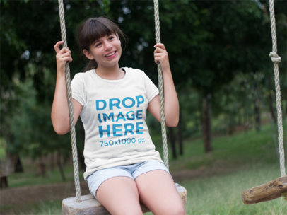 Kids T-Shirt Mockup Featuring a Girl in the Park 7972