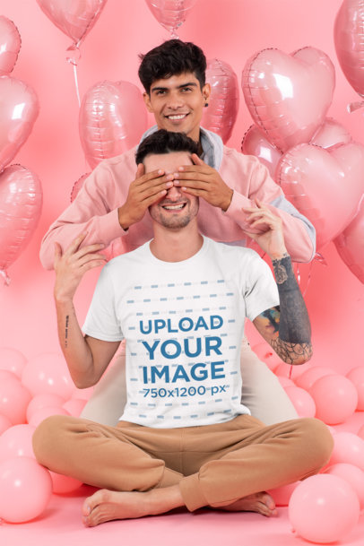 T-Shirt Mockup of a Playful Couple Surrounded by Heart Shaped Balloons