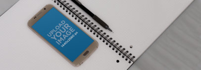 Android Mockup of a Samsung Galaxy S6 Over a Wireframe Notebook a7060