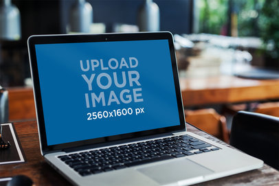 MacBook Mockup Featuring a Coffee Shop in the Background