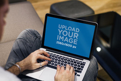 MacBook Pro Mockup Featuring a Modern Man Working 