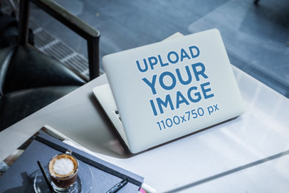 Laptop Cover Mockup of a Computer Placed Next to an Espresso