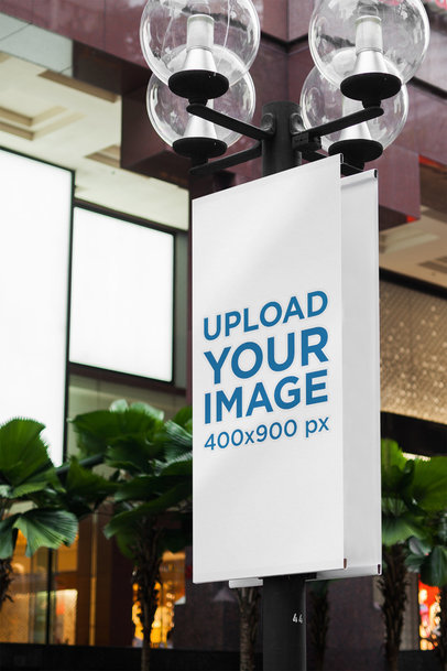Mockup of a Vertical Banner Placed on a Street Light Pole