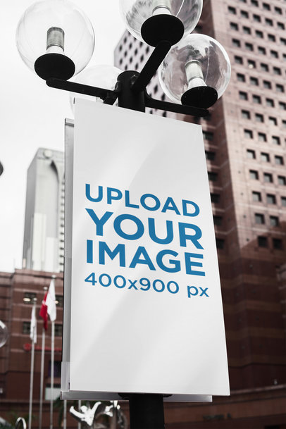 Mockup of a Banner Sign Attached to a Street Light Pole
