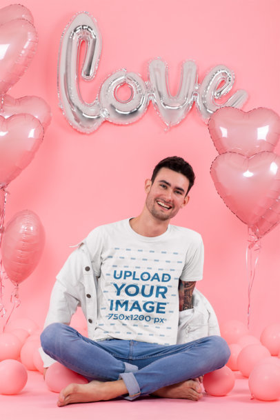 T-Shirt Mockup of a Tattooed Man Surrounded by Heart-Shaped Balloons 