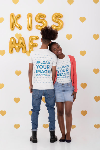 Both Sides T-Shirt Mockup of  a Young Couple at a Studio With Valentine's Decorations