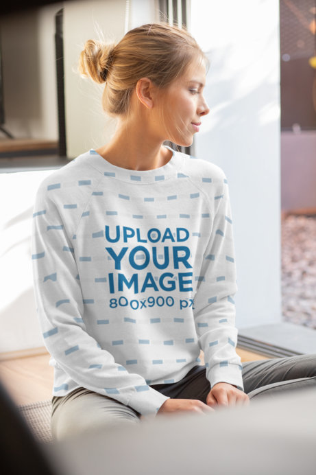Mockup of a Young Woman Wearing a Sublimated Sweatshirt