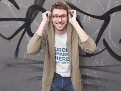 Mockup of a Smiling Hipster Guy Wearing a T-Shirt Outside