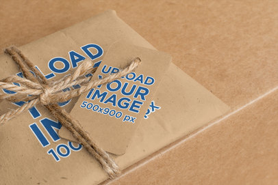 Brand Tag Mockup Featuring a Gift Wrapped in Kraft Paper 1302-el1