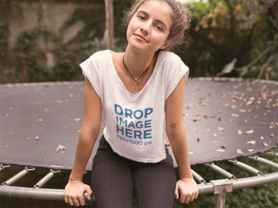Tee Mockup of a Hipster Girl Sitting on a Trampoline a11579