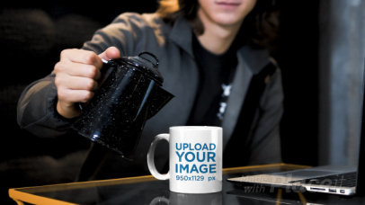 Video of a Man Pouring a Hot Drink Into a Coffee Mug