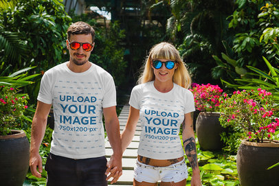 T-Shirt Mockup Featuring a Joyful Couple Walking and Holding Hands 
