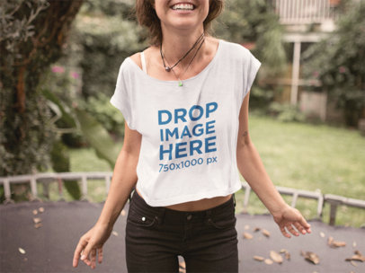 T-Shirt Mockup of a Smiling Woman Jumping on a Trampoline